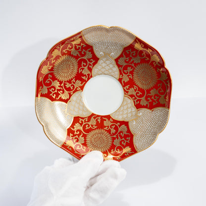 Side view of Arita porcelain cup with red and gold motif