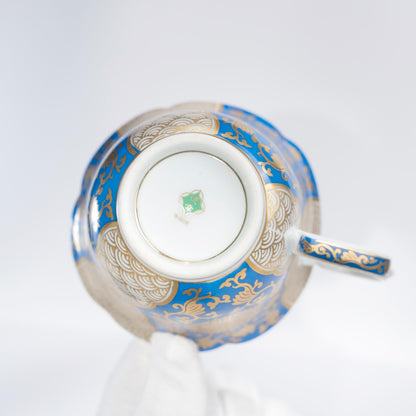 Top view of Arita blue and gold porcelain cup and saucer