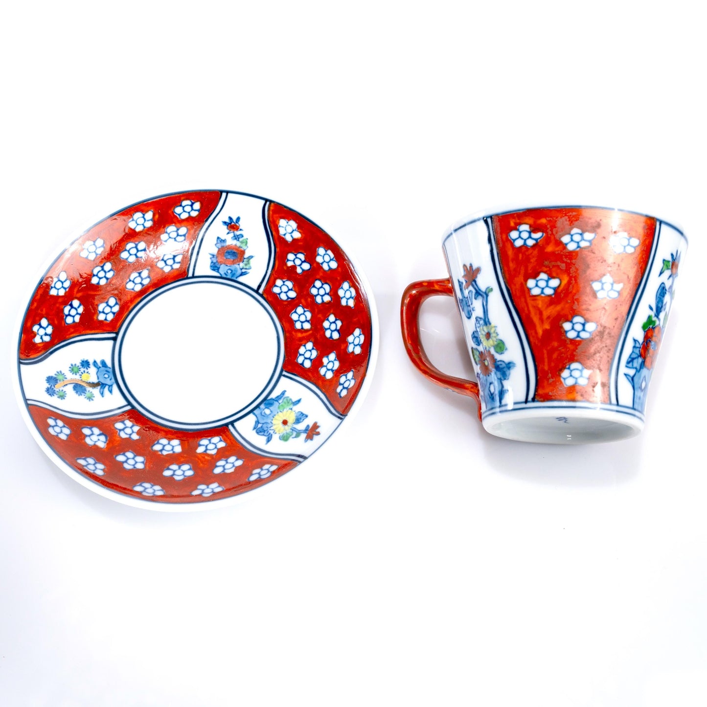 Cup and saucer displayed together on white background