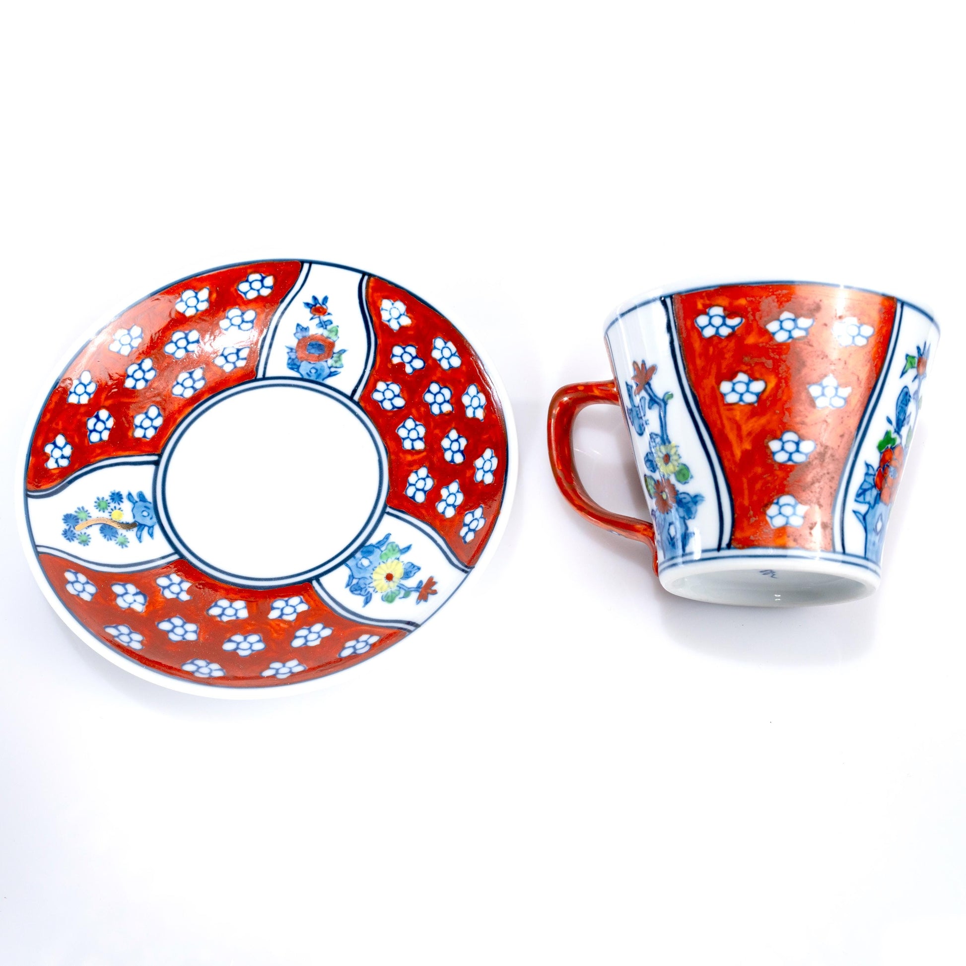 Cup and saucer displayed together on white background