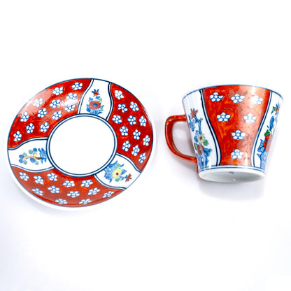 Cup and saucer displayed together on white background