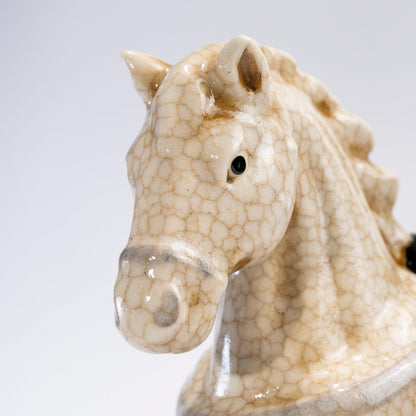 Front close-up of a crackle glaze lucky horse figurine