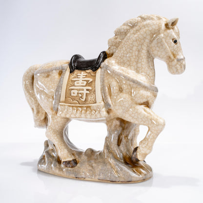 Full body view of zodiac horse figurine on black base