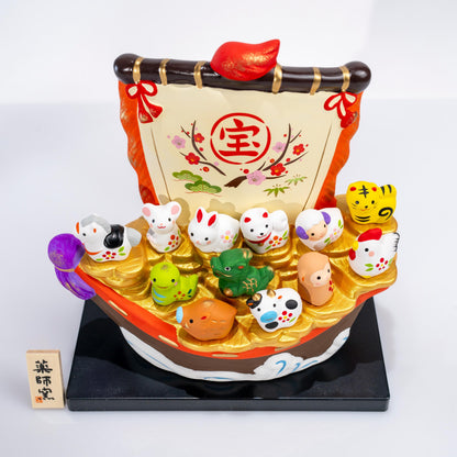 Angled view of zodiac treasure boat with sail and animal figurines