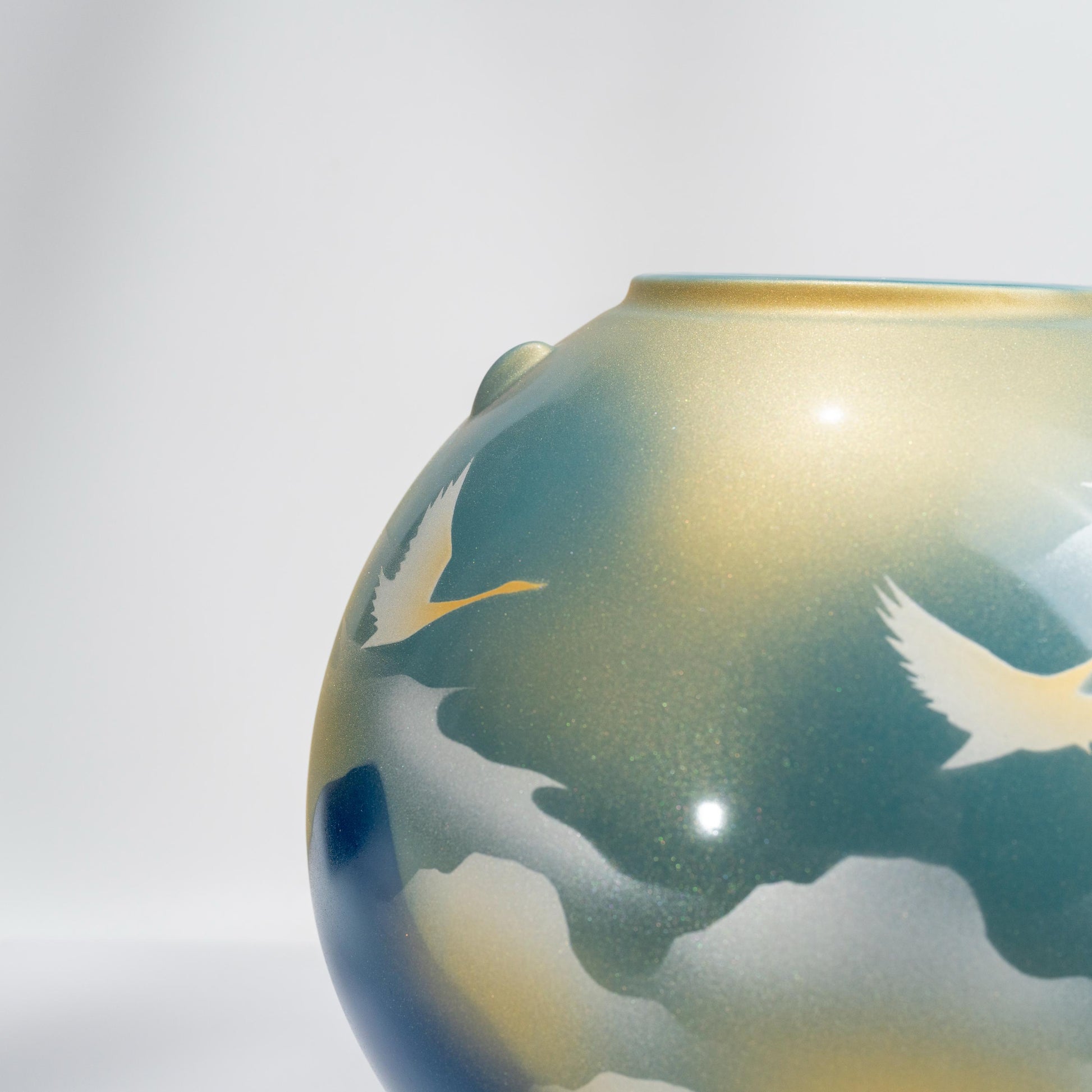 Close-up of cloud and crane painting on Kutani porcelain vase