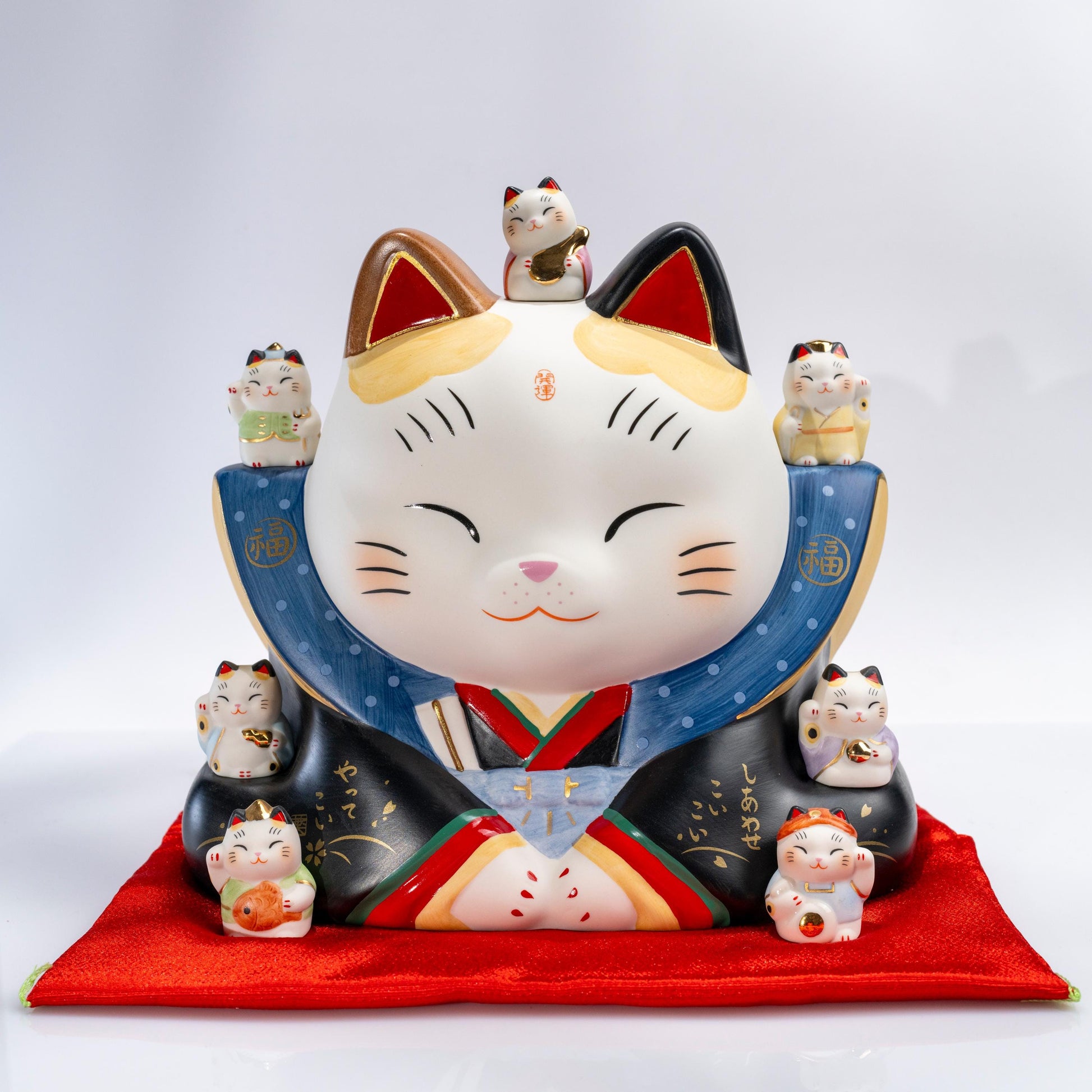 Large maneki neko piggy bank with Seven Gods of Fortune in ceramic