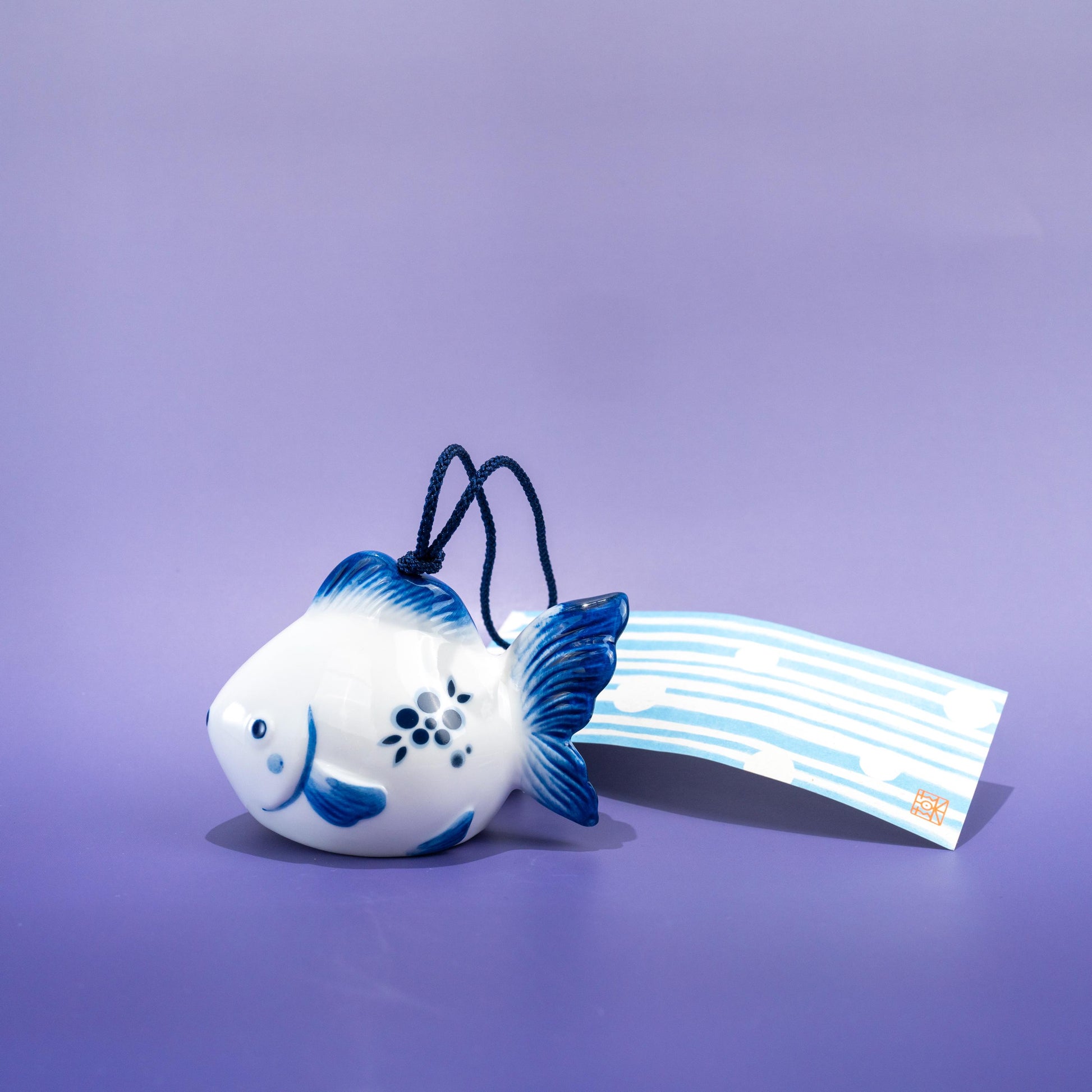 Close-up of hanging string and paper strip on wind chime