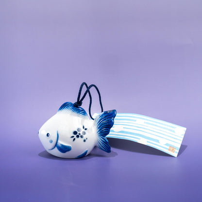 Close-up of hanging string and paper strip on wind chime