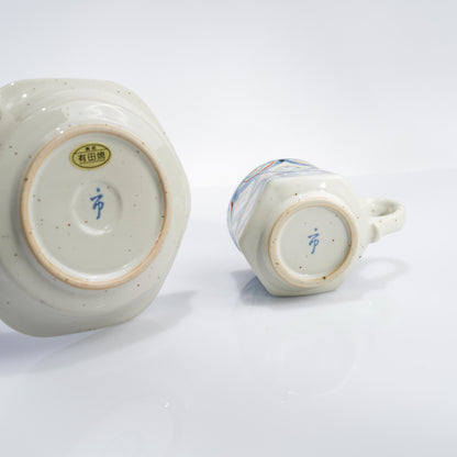 Front view of Japanese porcelain demitasse cup and saucer