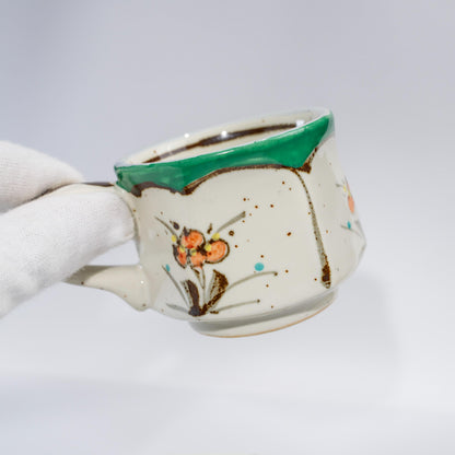 Angled view of hand-painted Arita espresso cup with hexagon body