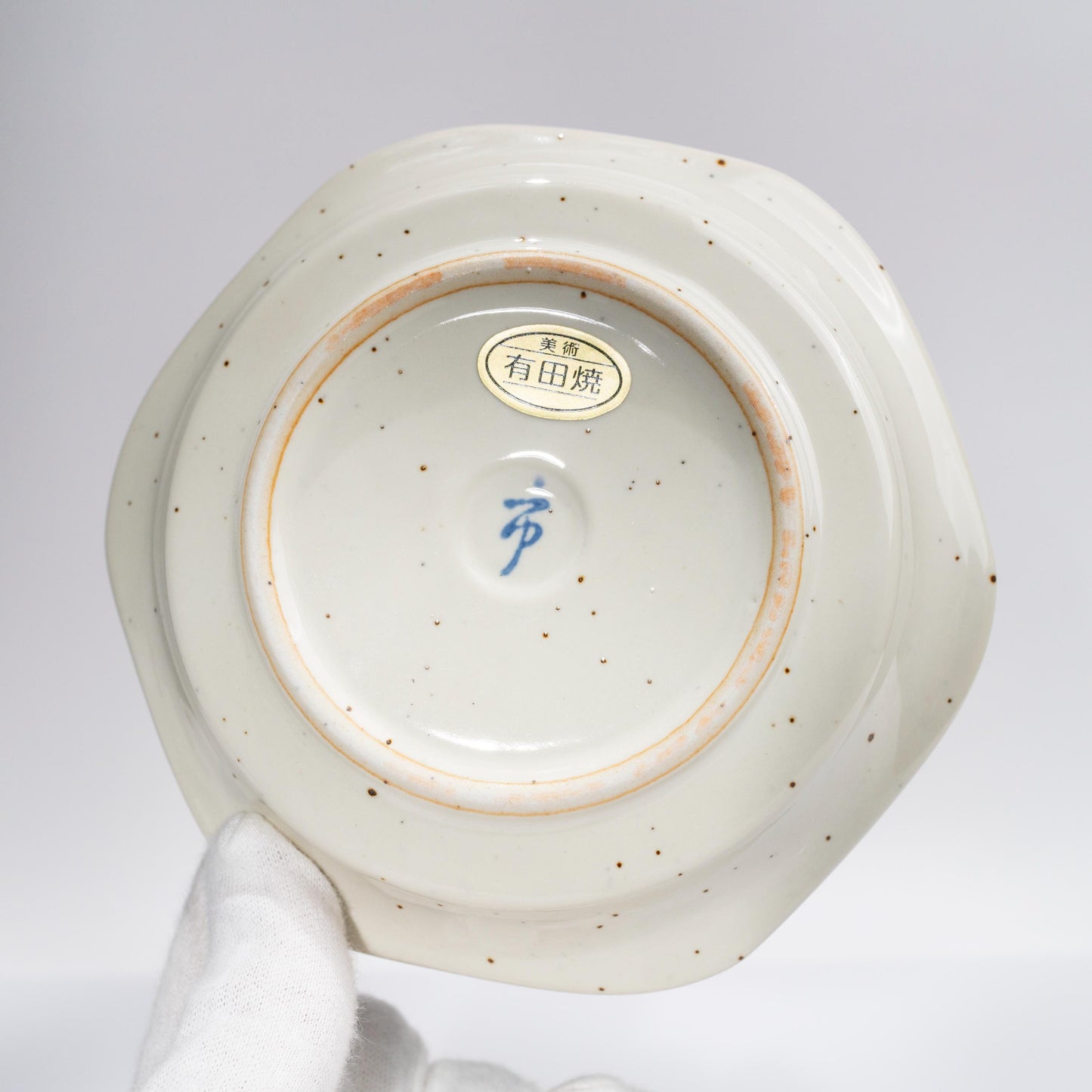 Underside of saucer showing porcelain foot ring and base
