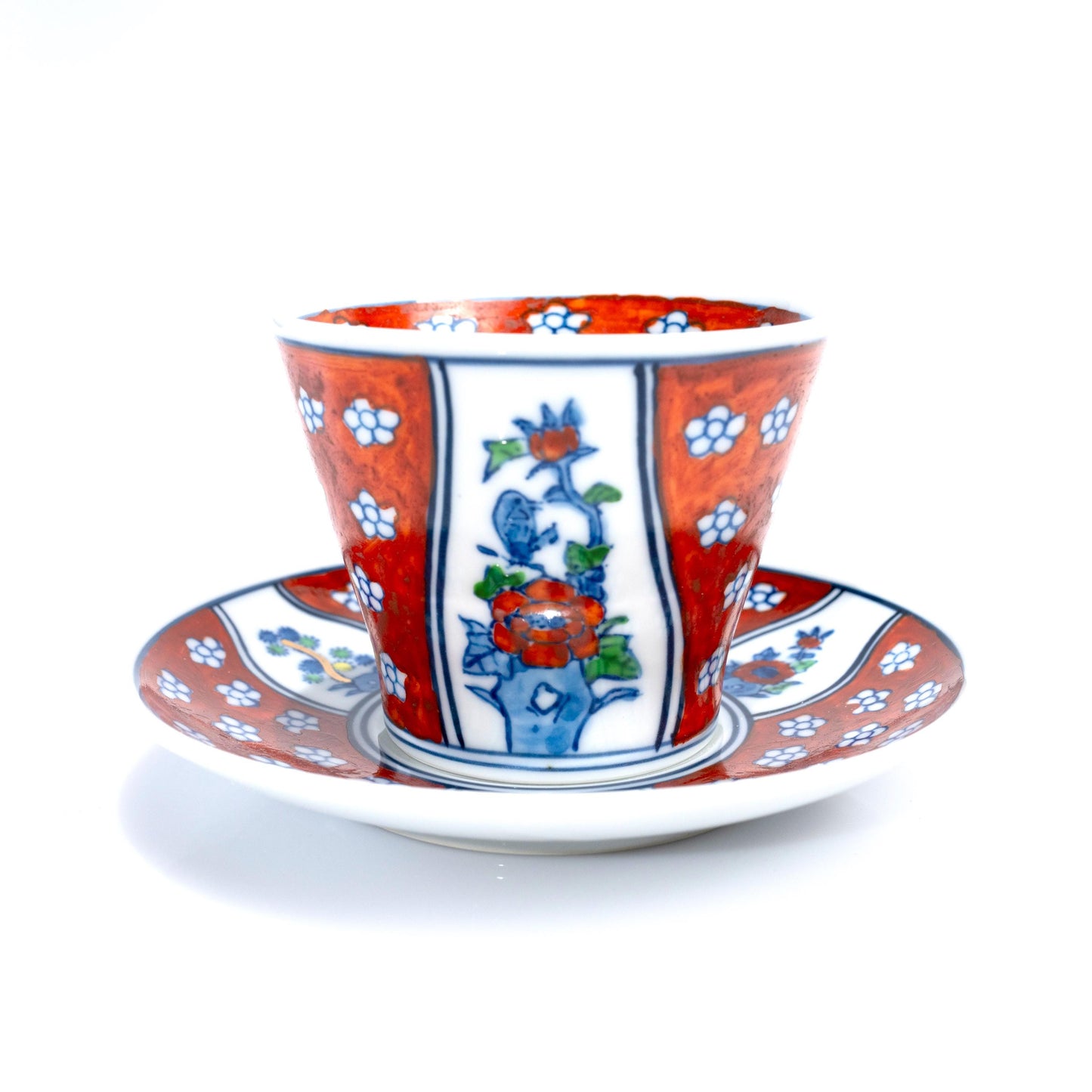 Close-up of hand-painted floral and leaf motif on the cup