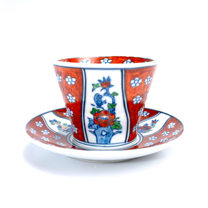 Close-up of hand-painted floral and leaf motif on the cup
