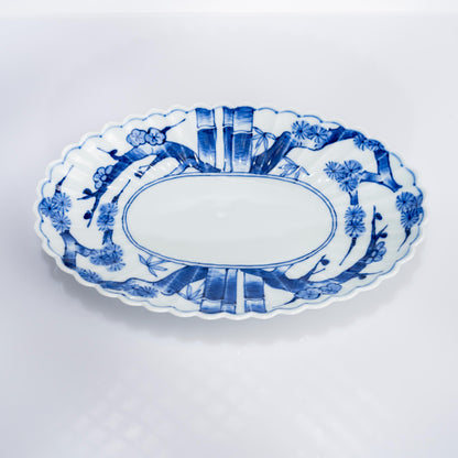 Top view of oval plate showing chrysanthemum-shaped rim