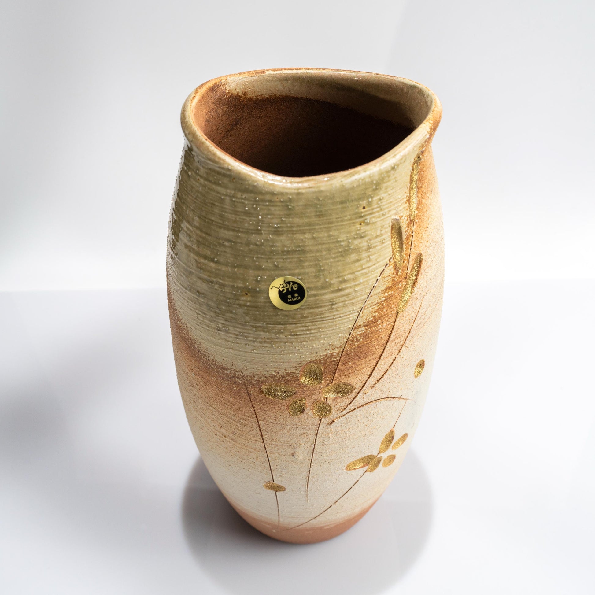 Front angle of handmade Shigaraki ikebana vase with tall form