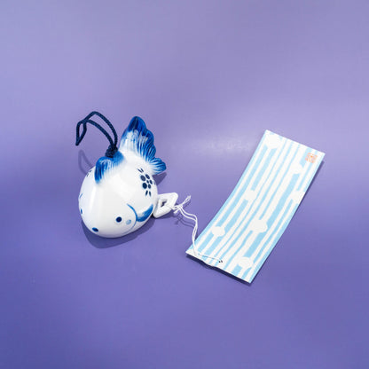 Side view of ceramic fish-shaped wind chime
