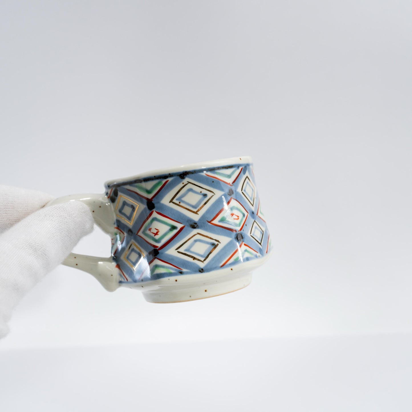Top view of saucer showing geometric hand-painted design