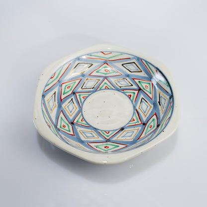 Top view of demitasse cup and saucer with hand-painted diamond pattern