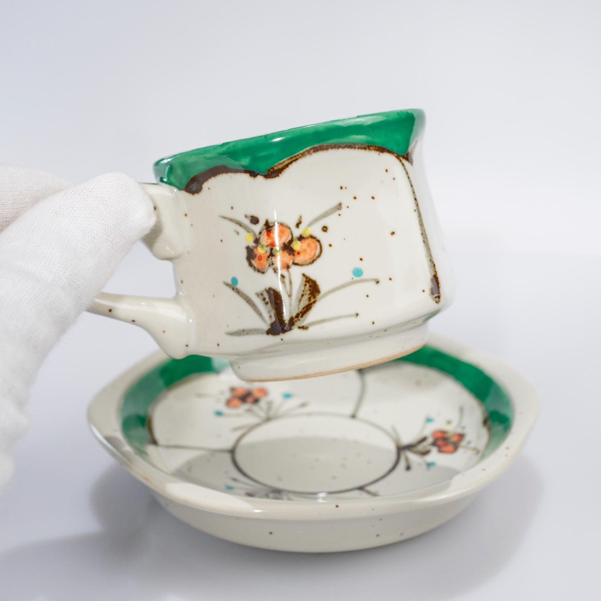 Arita green floral hexagon demitasse cup and saucer on white background