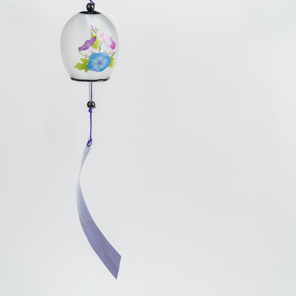 Japanese glass bon furin wind chime with morning glory blossoms in pink, blue and purple on a frosted bell