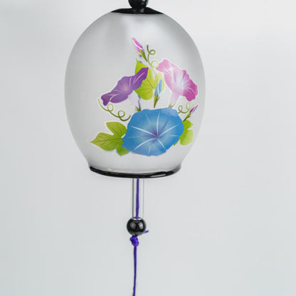 Morning glory asagao glass wind chime hanging, showing the purple braided cord and black accent beads