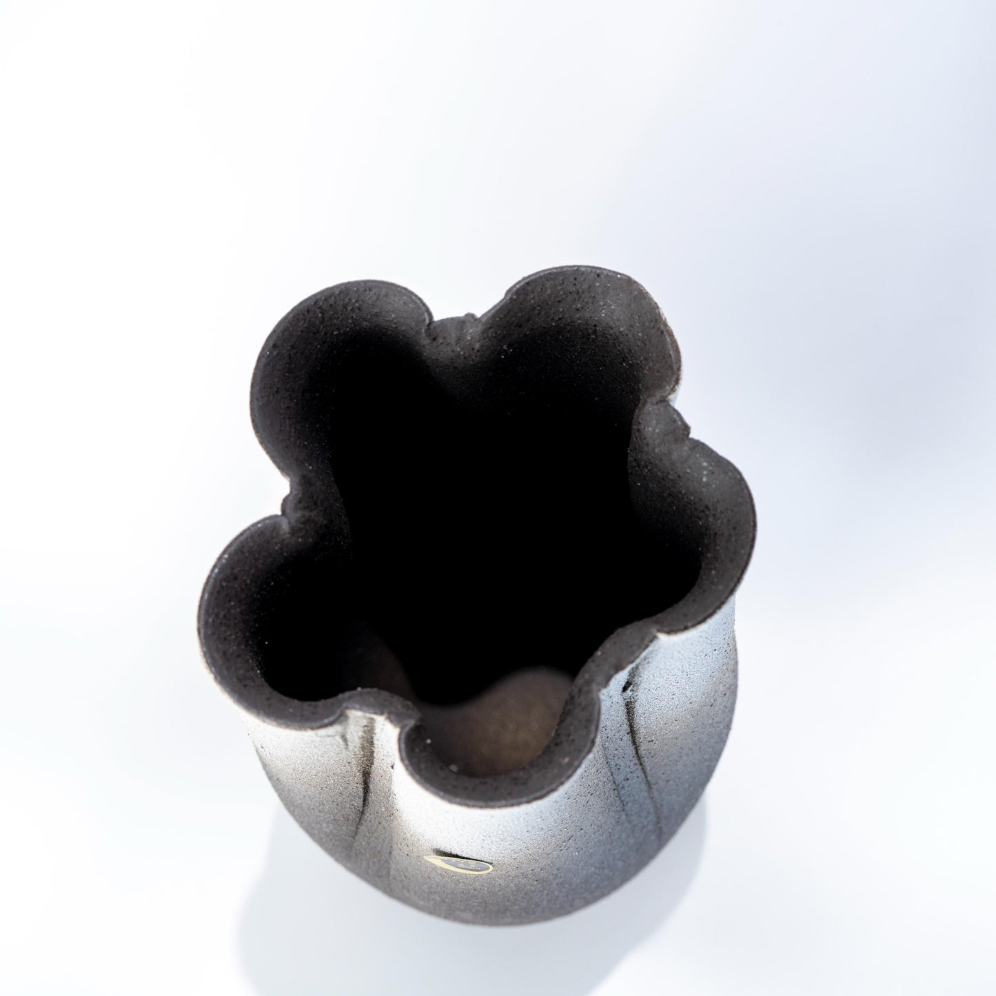 Top view of Shigaraki ikebana vase with sculpted flower-shaped opening