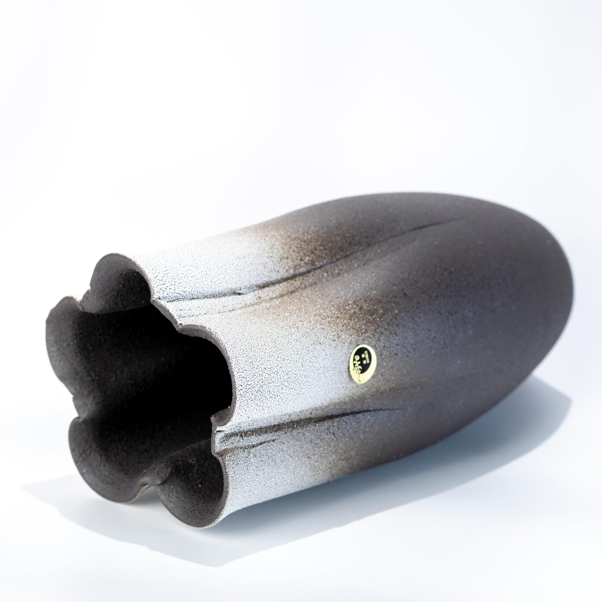 Side view of handmade Shigaraki tall vase in black stoneware