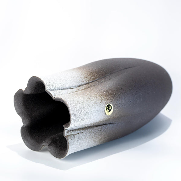 Side view of handmade Shigaraki tall vase in black stoneware