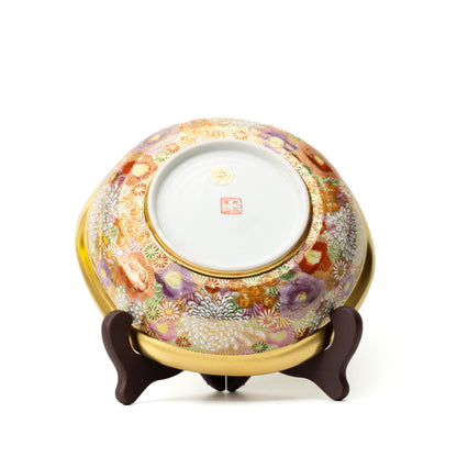 Back of the Kinhanazume serving bowl on a stand, showing floral decoration around a white base with maker's marks.