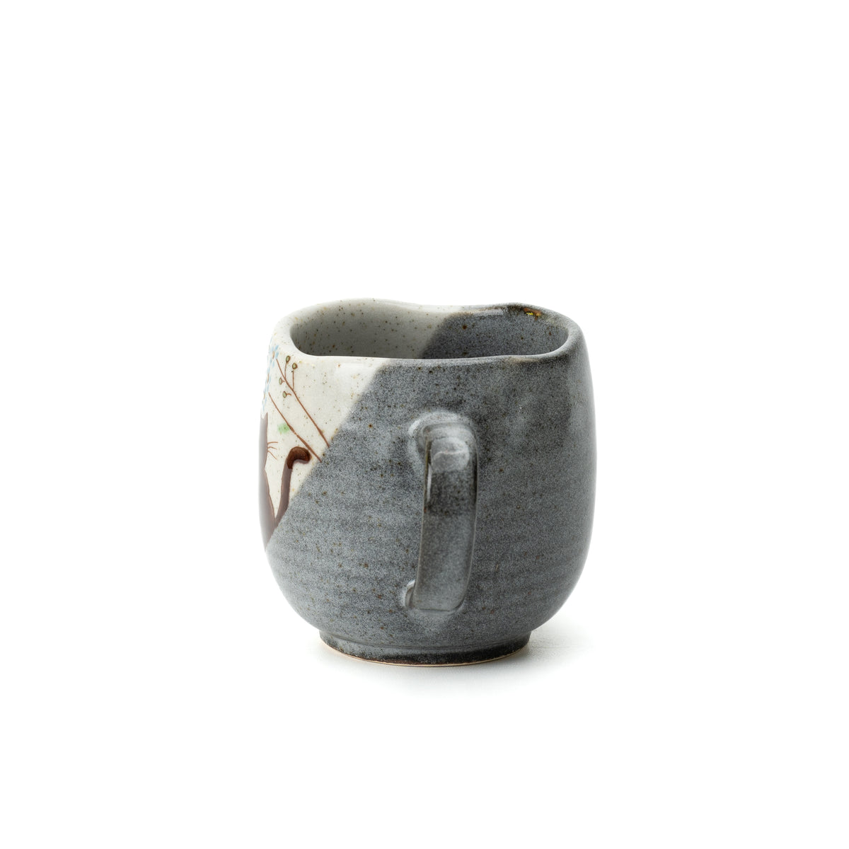 Handle-side view of the Kutani Hidamari mug, showing its gray textured finish and dark interior.