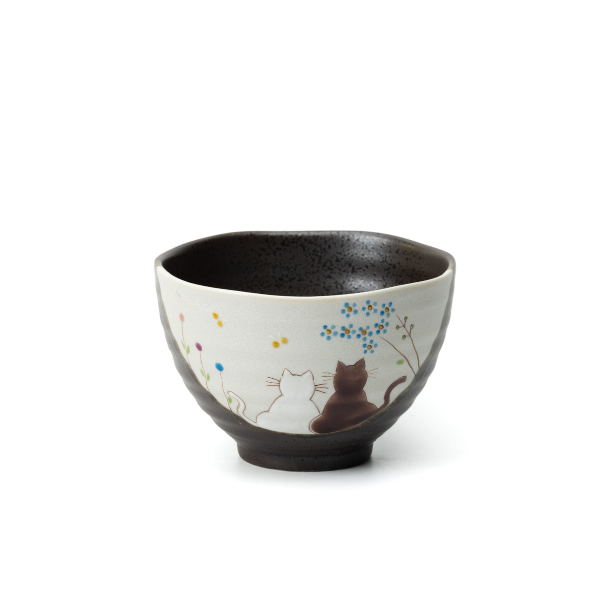 Kutani Hidamari bowl with two cats beneath flowering branches and a dark interior.