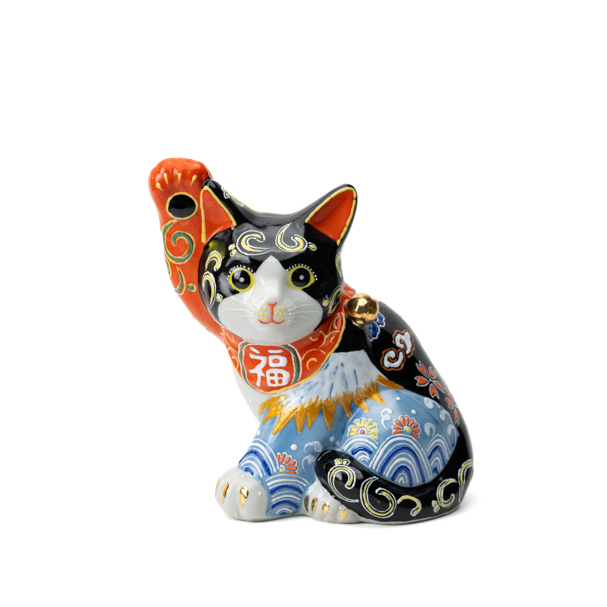 Black Kutani lucky cat with one paw raised, a white Mount Fuji and blue wave decoration.