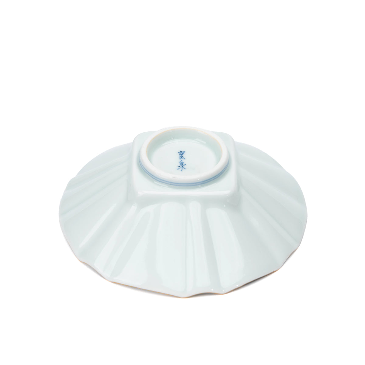 Underside of the white fluted bowl with a blue maker's mark.