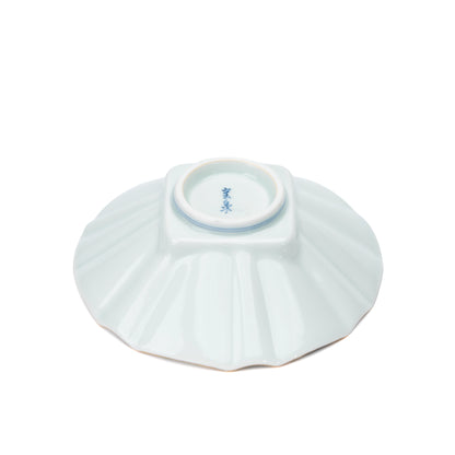 Underside of the white fluted bowl with a blue maker's mark.
