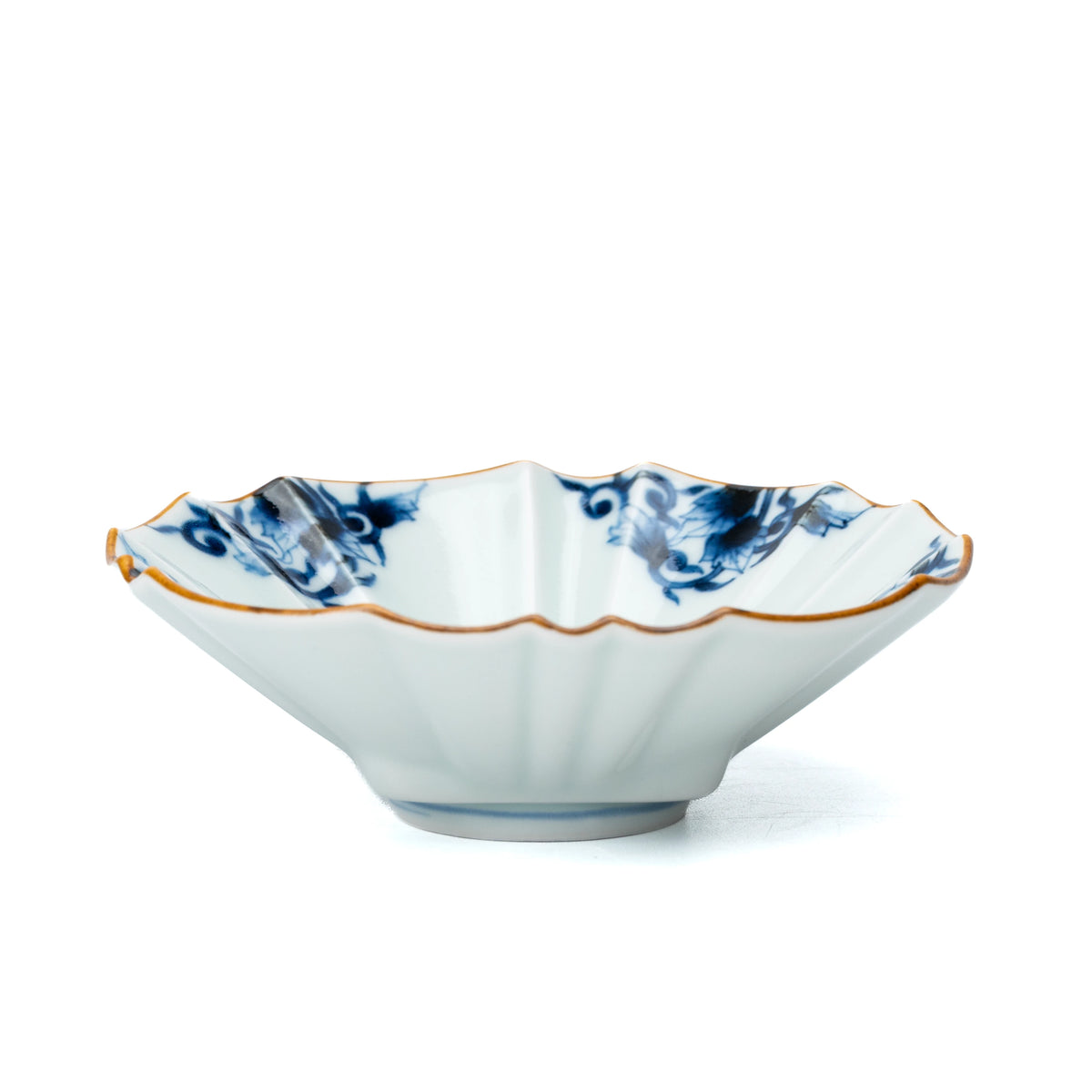 Low side view of the fluted blue and white bowl.