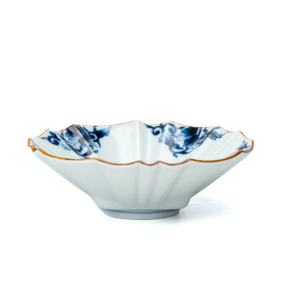 Low side view of the fluted blue and white bowl.
