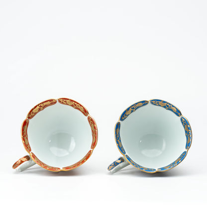 White interiors of the red and blue cups shown together for comparison.