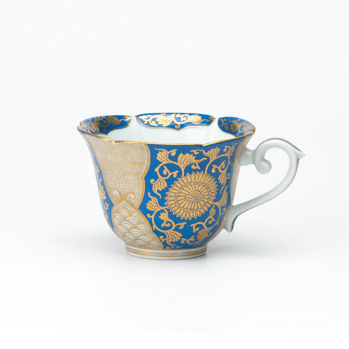 Side view of the blue and gold cup with a white handle.