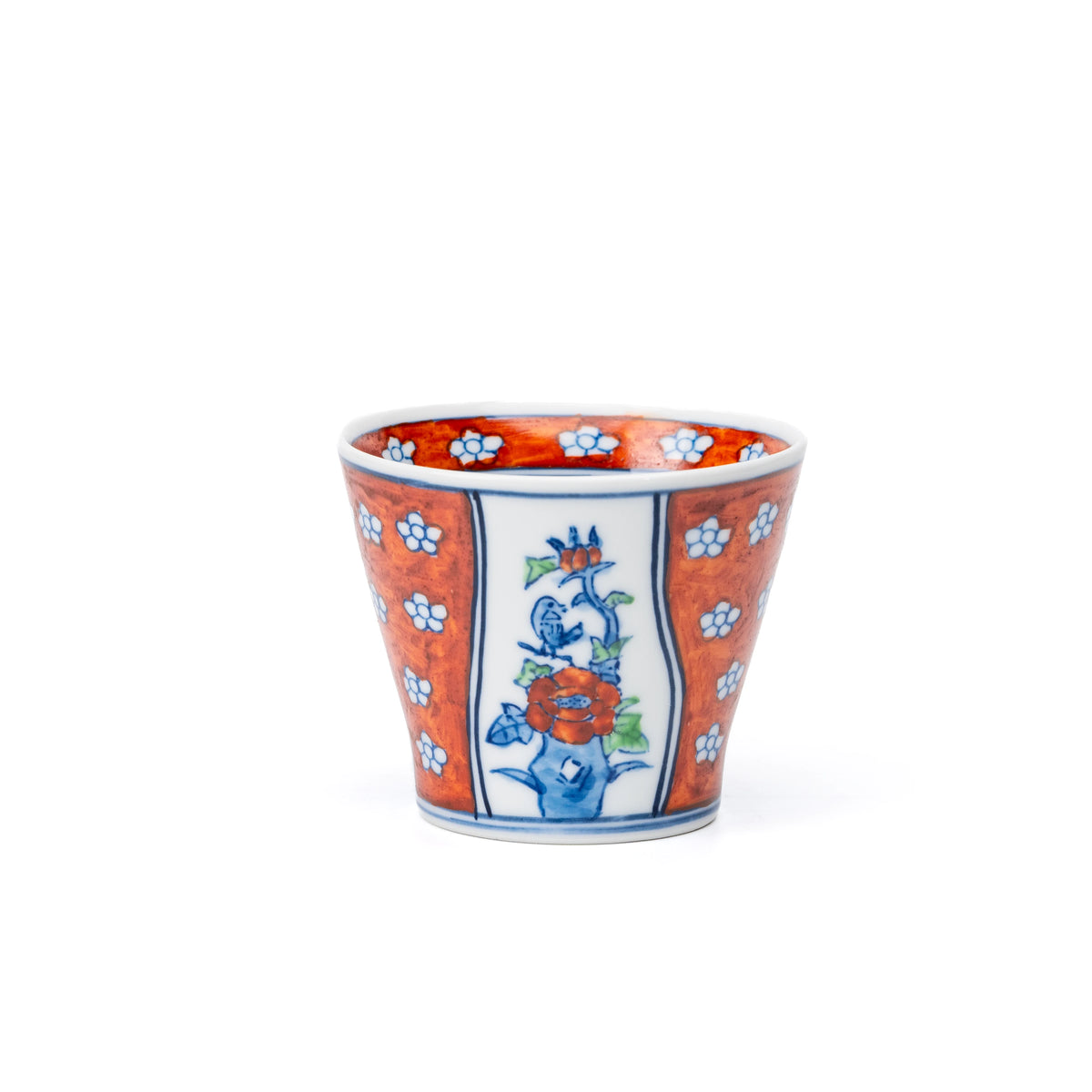 Red floral cup with a blue decorative panel, viewed from the side.