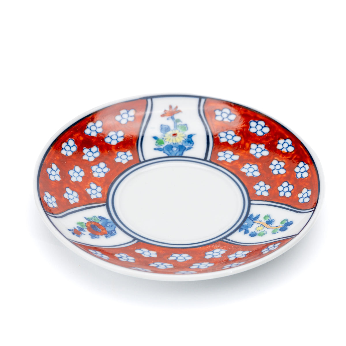 Angled view of the red floral saucer and white center.