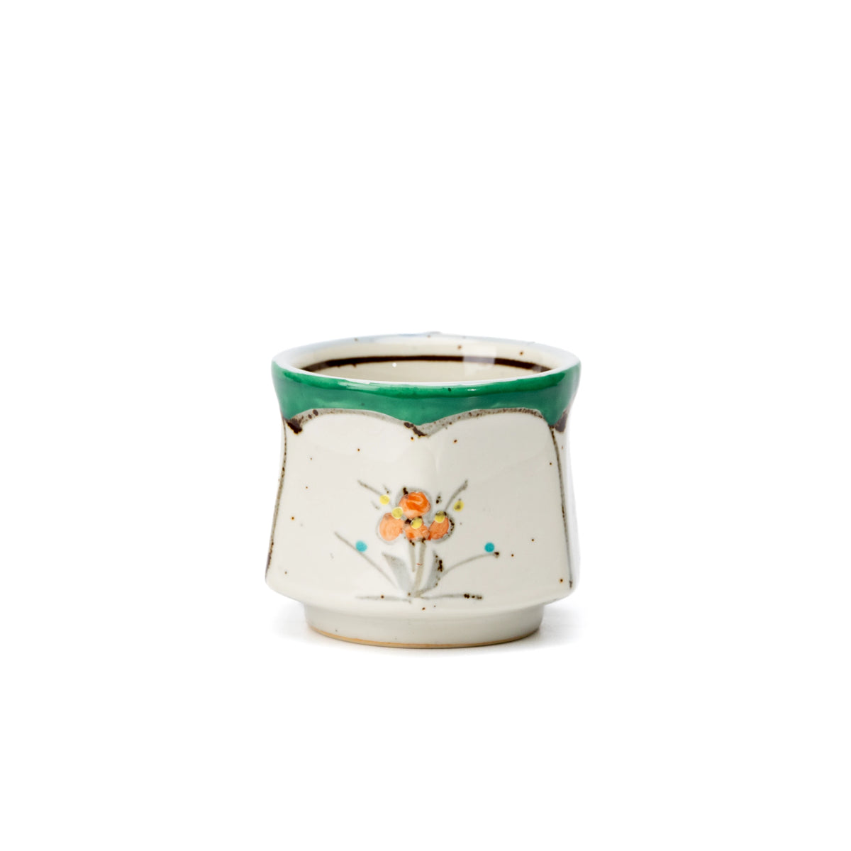 Opposite side of the green-rimmed floral cup.