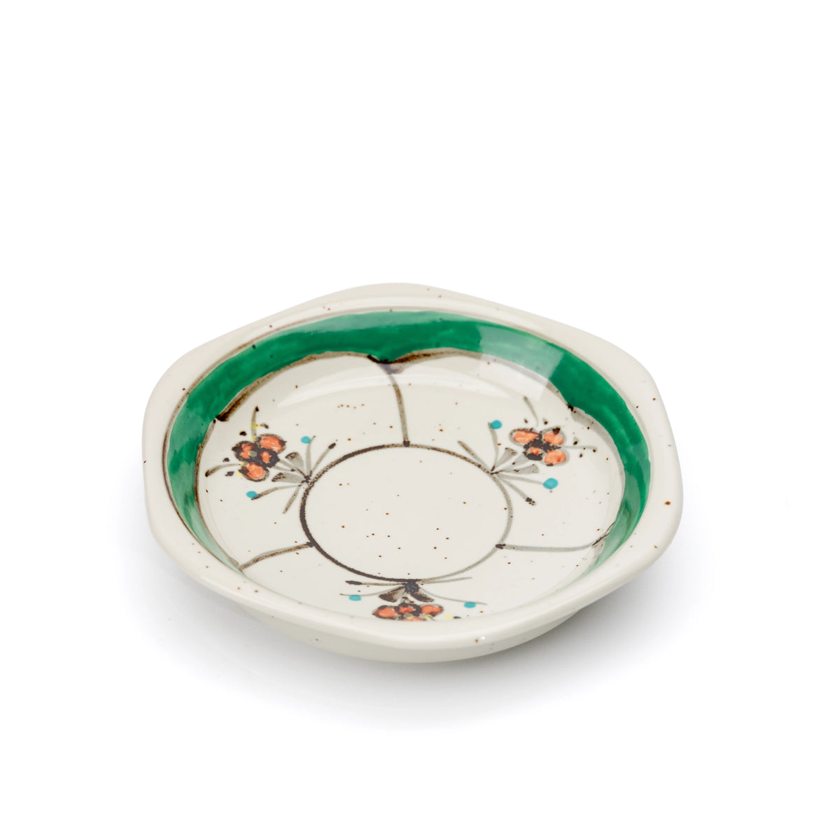 Green-rimmed hexagonal saucer viewed from above.