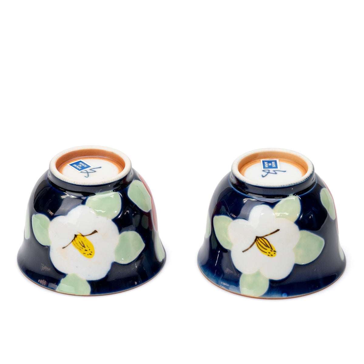 Undersides of the two blue camellia cups.