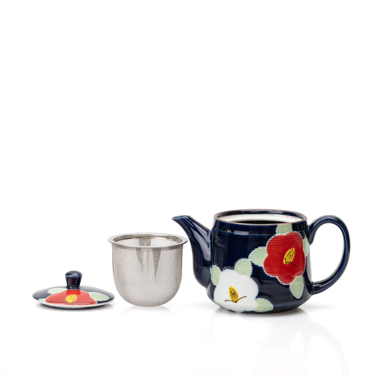 Blue camellia teapot with its lid removed beside a metal strainer.
