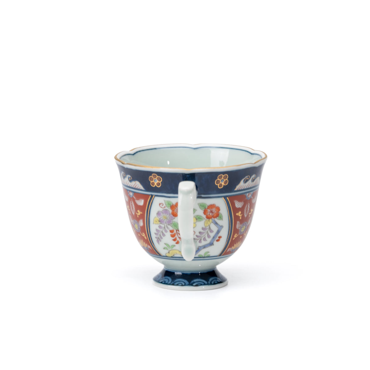 Side view of the blue-rimmed floral cup and white handle.