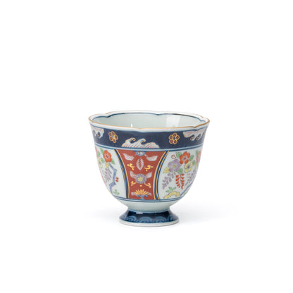 Opposite side of the blue and red cup with floral panels.