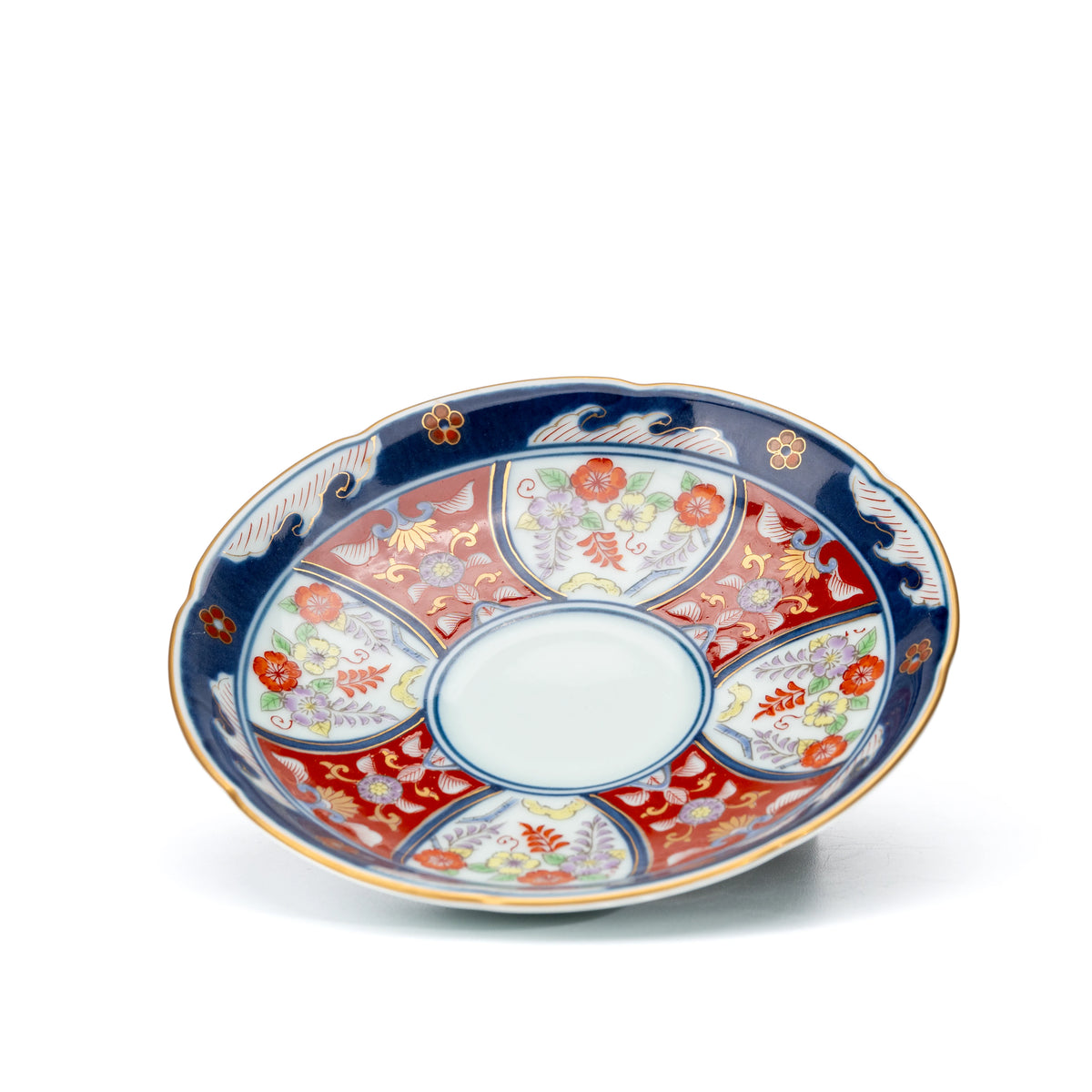 Matching blue and red floral saucer viewed from above.