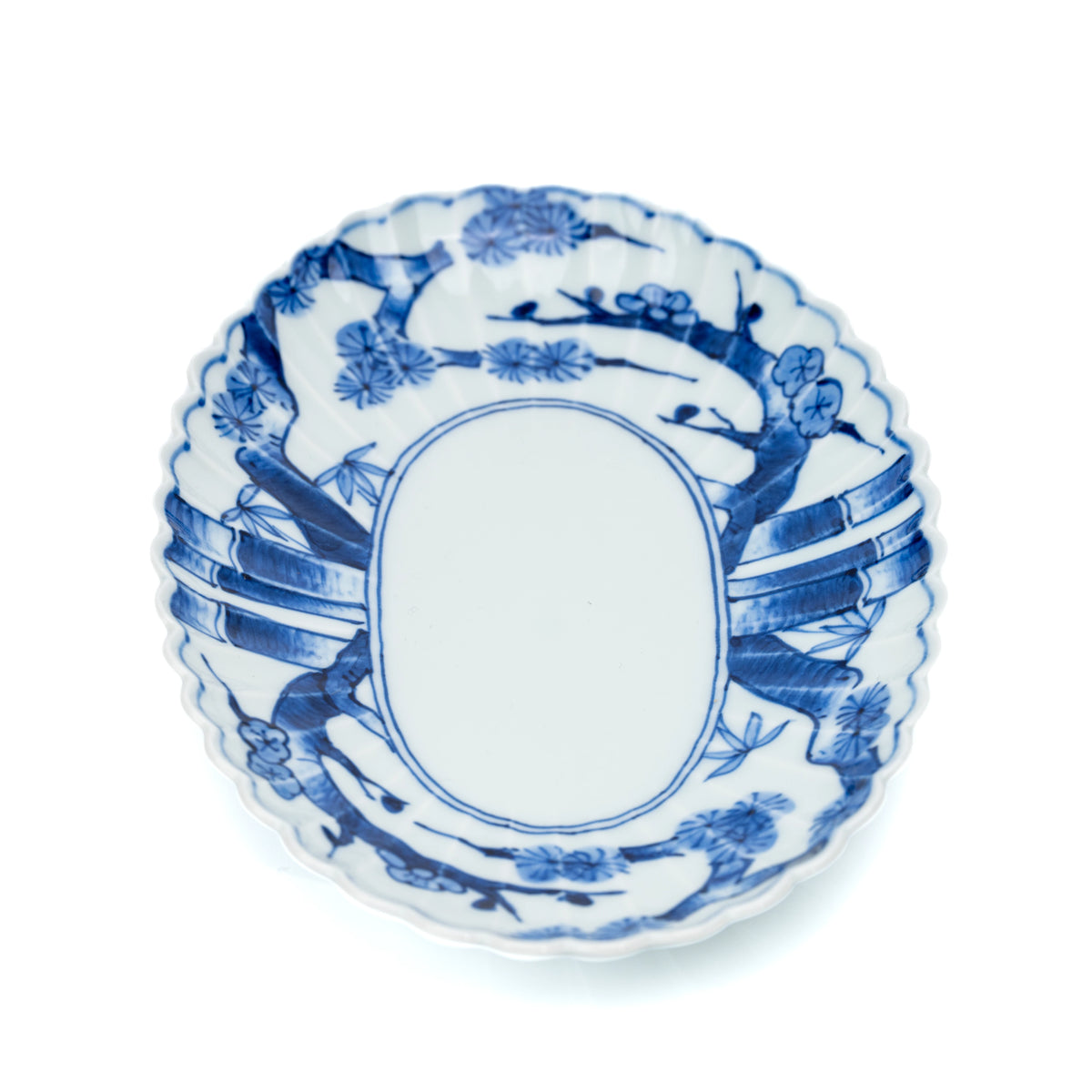 Blue and white oval platter viewed from above in a vertical orientation.