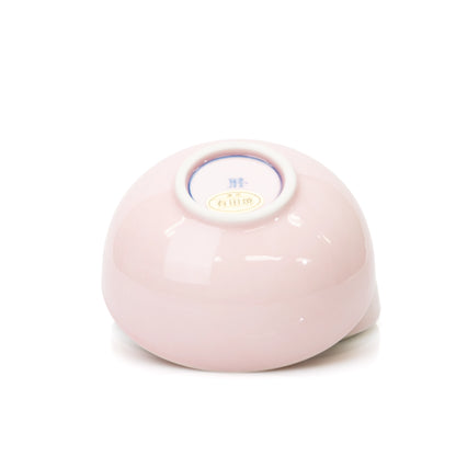 Underside and circular foot of the pink lidded bowl.