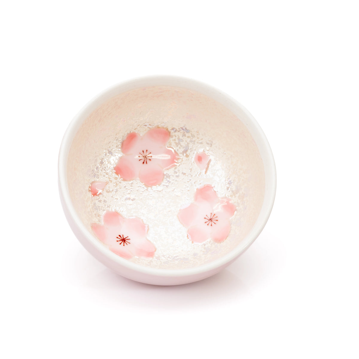 Pink cherry blossom decoration inside the open bowl.